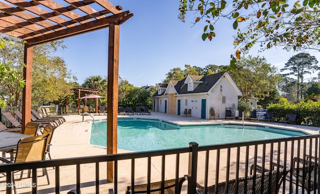 view of swimming pool with a pergola and a patio