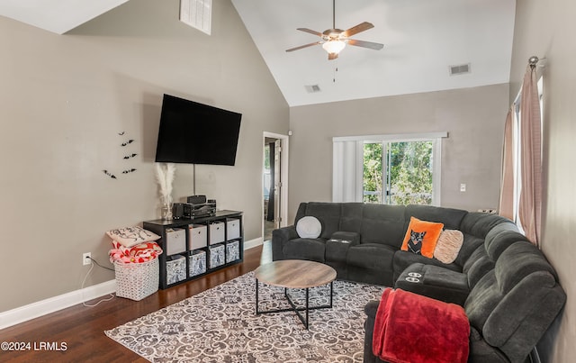 living room featuring dark wood-type flooring, high vaulted ceiling, and ceiling fan