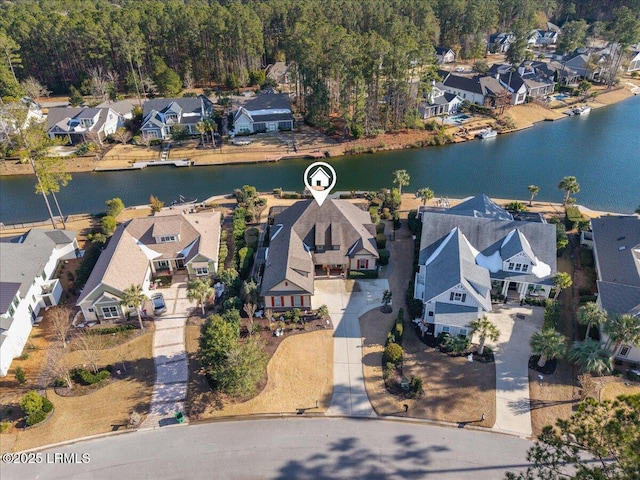 birds eye view of property featuring a water view