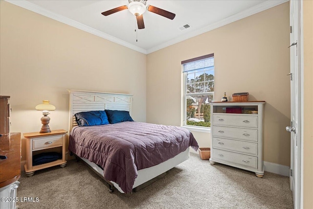 bedroom with ornamental molding, carpet floors, and ceiling fan