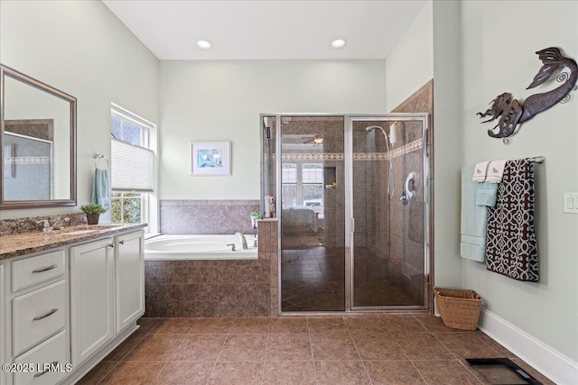 bathroom with vanity, tile patterned flooring, and independent shower and bath