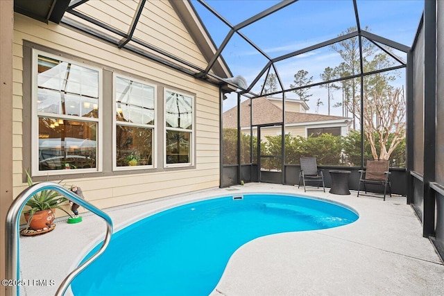 view of pool featuring a lanai and a patio area