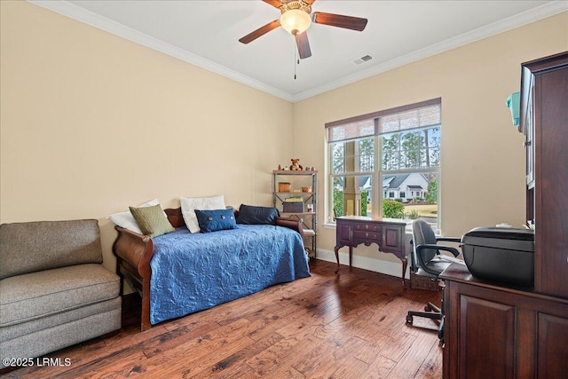 bedroom featuring ceiling fan, wood-type flooring, and ornamental molding