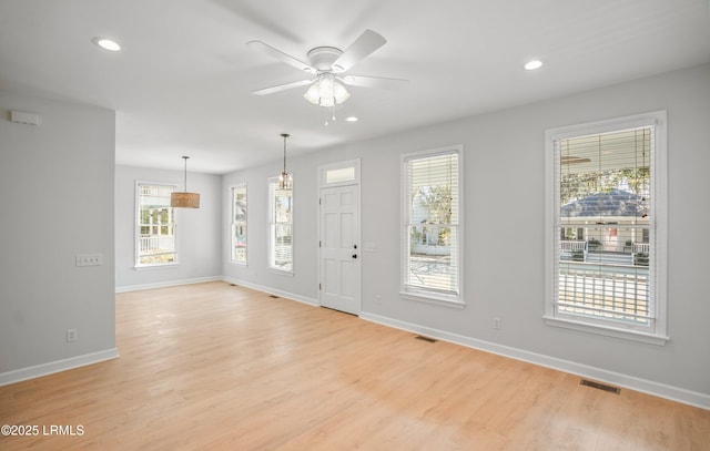 entryway featuring recessed lighting, visible vents, baseboards, and light wood-style floors