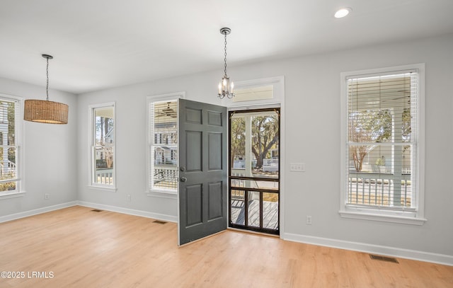 entryway featuring recessed lighting, visible vents, baseboards, and light wood-style flooring