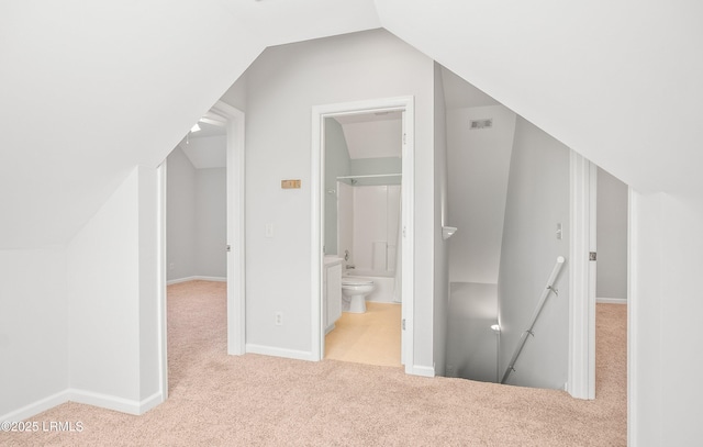 bonus room with lofted ceiling, baseboards, and carpet floors