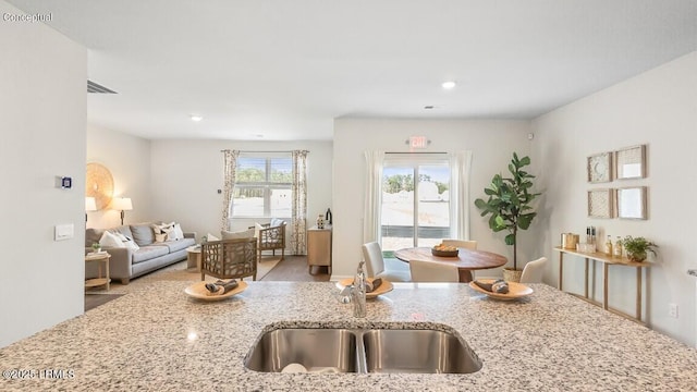 116 Twickenham Loop, Yemassee, SC 29945 - kitchen with open floor plan, light stone counters, and recessed lighting