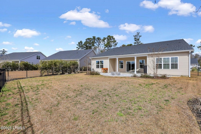 back of property featuring a patio, a fenced backyard, and a yard