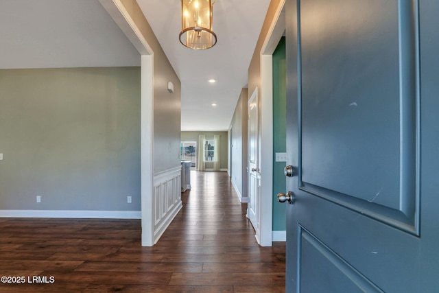 entryway featuring dark wood-style floors, baseboards, a chandelier, and recessed lighting
