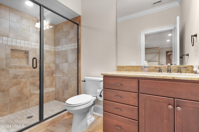 bathroom with a shower with shower door, ornamental molding, vanity, toilet, and tile patterned floors