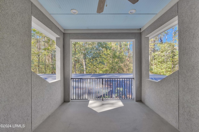 sunroom featuring ceiling fan and a healthy amount of sunlight