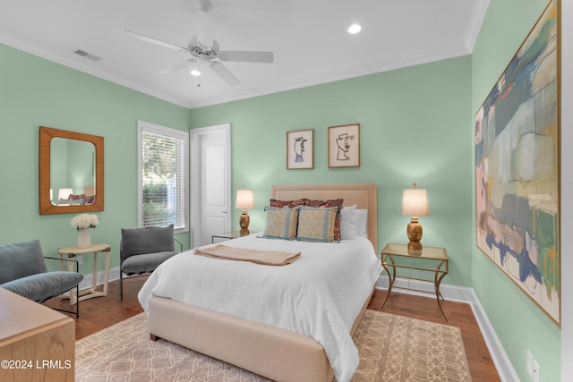 bedroom with crown molding, wood-type flooring, and ceiling fan