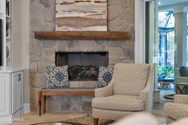 sitting room with a fireplace