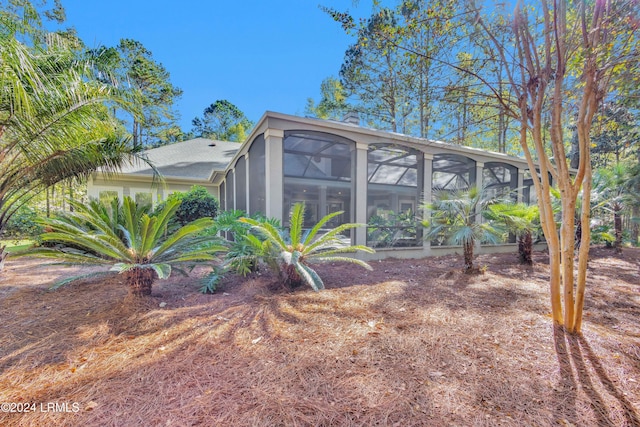 view of yard with a sunroom