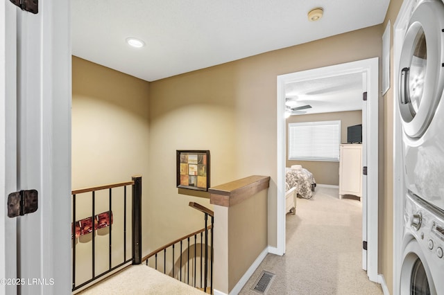 13 Harbourside Ln Unit 7170, Hilton Head Island, SC 29928 - washroom with estacked washer and dryer, carpet flooring, baseboards, a ceiling fan, and recessed lighting