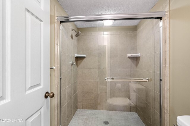 13 Harbourside Ln Unit 7170, Hilton Head Island, SC 29928 - bathroom featuring toilet, a shower stall, and a textured ceiling