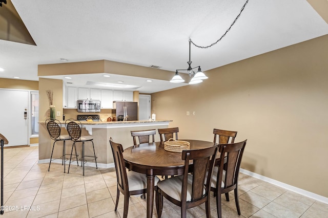 13 Harbourside Ln Unit 7170, Hilton Head Island, SC 29928 - dining space with light tile patterned floors, baseboards, recessed lighting, and a chandelier