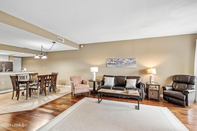 13 Harbourside Ln Unit 7170, Hilton Head Island, SC 29928 - living room with light wood-type flooring and baseboards