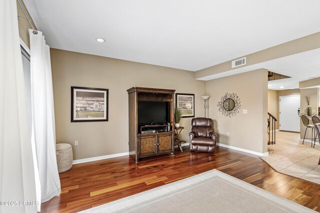 13 Harbourside Ln Unit 7170, Hilton Head Island, SC 29928 - living area featuring wood finished floors, baseboards, recessed lighting, and stairway