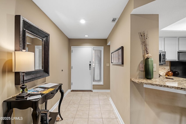 13 Harbourside Ln Unit 7170, Hilton Head Island, SC 29928 - foyer entrance with baseboards, light tile patterned flooring, and recessed lighting