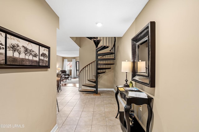 13 Harbourside Ln Unit 7170, Hilton Head Island, SC 29928 - corridor featuring stairway, light tile patterned floors, and baseboards