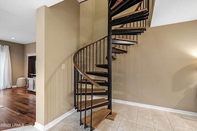 13 Harbourside Ln Unit 7170, Hilton Head Island, SC 29928 - stairway with baseboards, recessed lighting, and tile patterned flooring