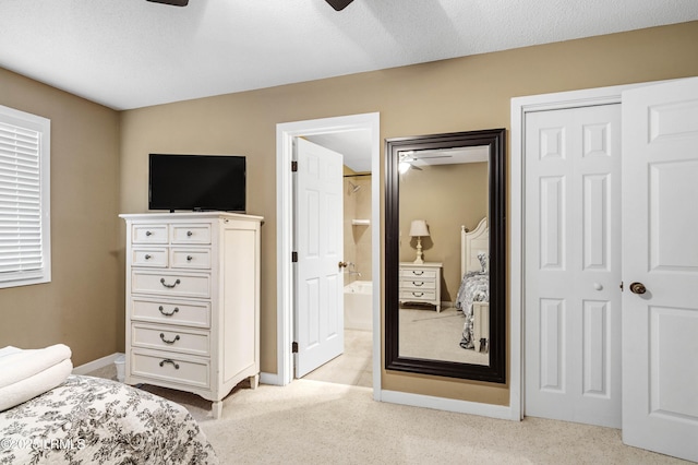 13 Harbourside Ln Unit 7170, Hilton Head Island, SC 29928 - bedroom with light colored carpet, ensuite bathroom, a ceiling fan, and baseboards