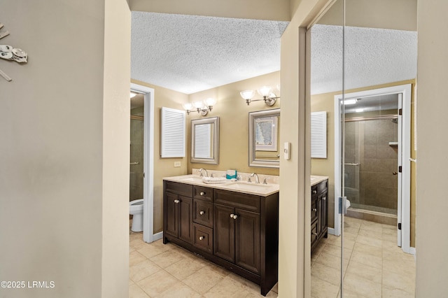 13 Harbourside Ln Unit 7170, Hilton Head Island, SC 29928 - full bathroom with toilet, double vanity, tile patterned flooring, and a textured ceiling