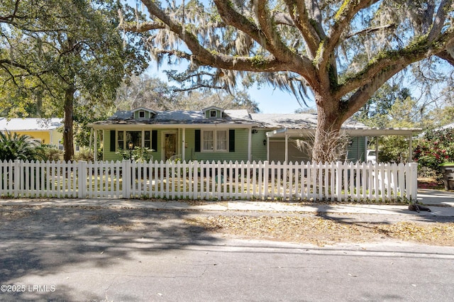 view of front of house with an attached garage and a fenced front yard