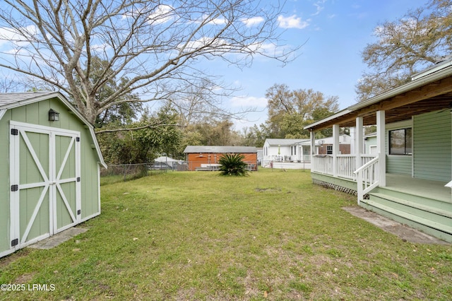 156 James St, Beaufort, SC 29902 - view of yard featuring an outdoor structure, a storage unit, and fence