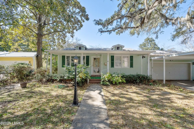 view of front facade featuring a porch, a garage, and driveway