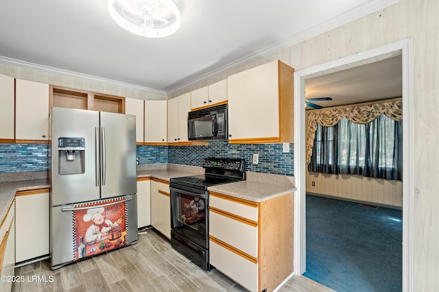 kitchen featuring black appliances, ornamental molding, light countertops, decorative backsplash, and ceiling fan