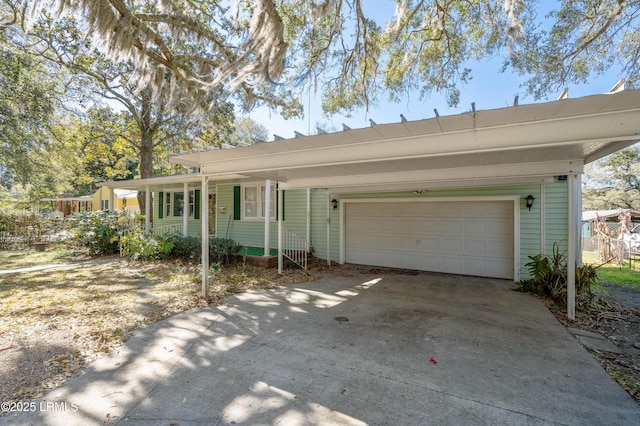 ranch-style home featuring an attached garage and driveway