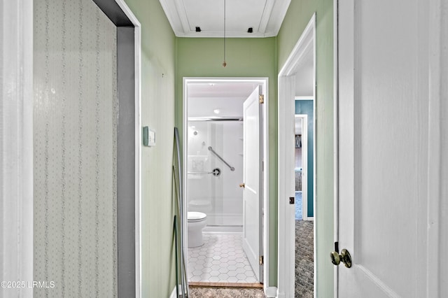 bathroom featuring tile patterned floors, toilet, a shower stall, and crown molding