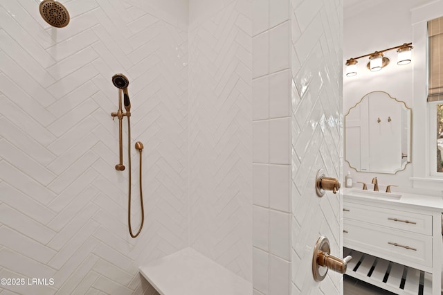 bathroom with vanity and a tile shower