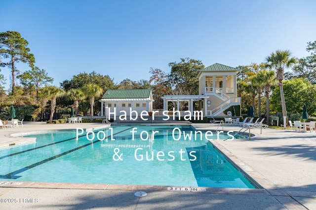 view of swimming pool featuring a pergola and a patio