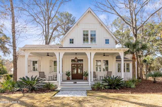 modern farmhouse style home with french doors, ceiling fan, and a porch