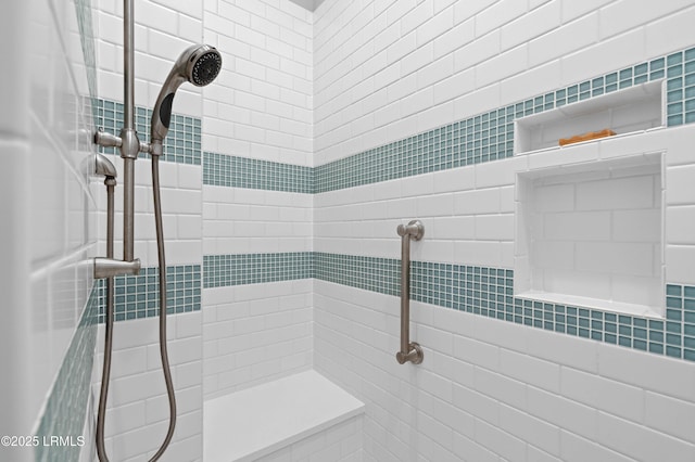 bathroom with a tile shower