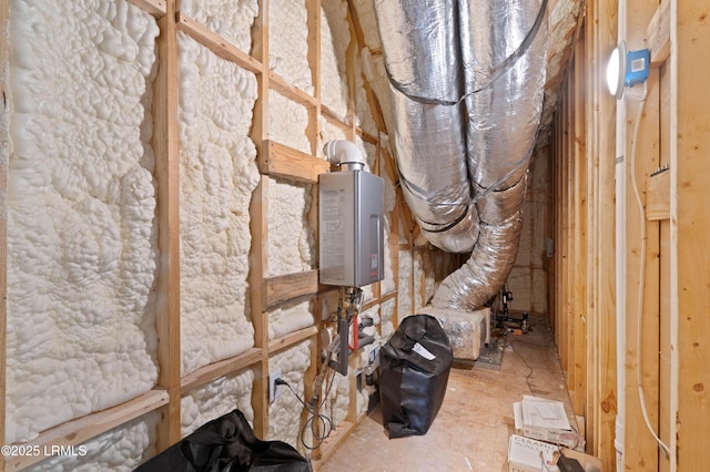 unfinished attic featuring tankless water heater