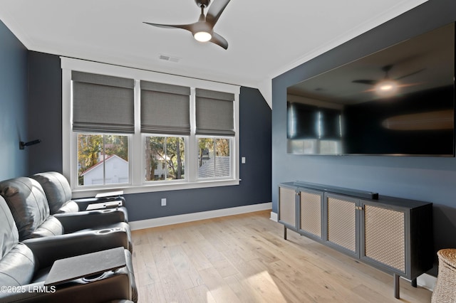 living room with light hardwood / wood-style floors and ceiling fan