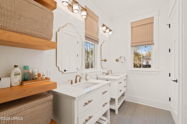 bathroom featuring vanity and crown molding