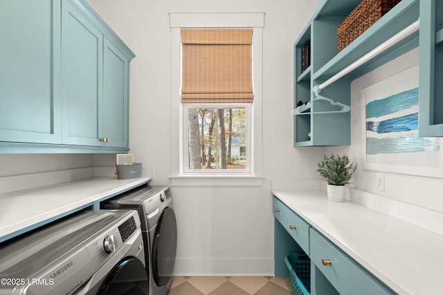 washroom featuring independent washer and dryer and cabinets