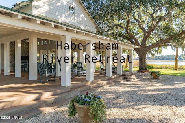 view of patio featuring a water view