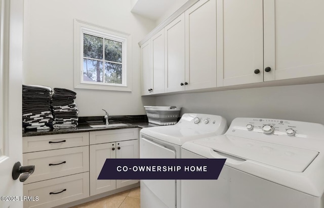 laundry room with a sink, cabinet space, light tile patterned floors, and washer and dryer