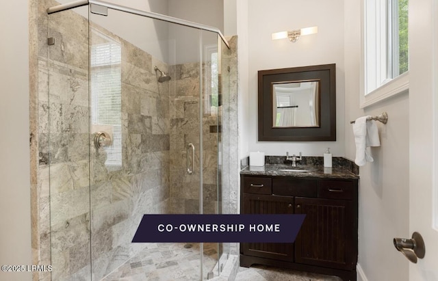 bathroom with vanity and a shower stall