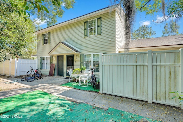 back of house with a patio area