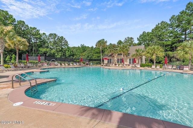 21 Woods Bay Rd, Bluffton, SC 29910 - community pool with a patio area and view of wooded area
