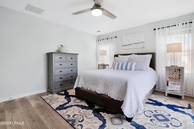 bedroom featuring ceiling fan and light hardwood / wood-style flooring