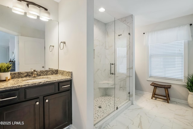 bathroom with an enclosed shower and vanity