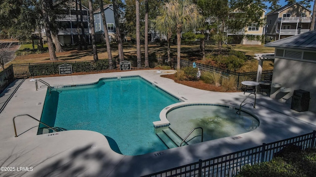 view of swimming pool with a community hot tub